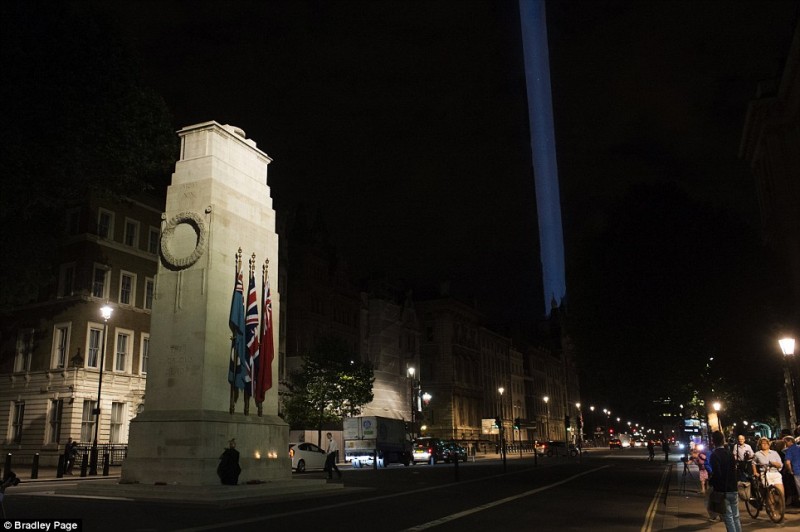 A single beam pierces the sky as the lights go out across Britain: Tributes to the fallen a century since World War One was declared  6