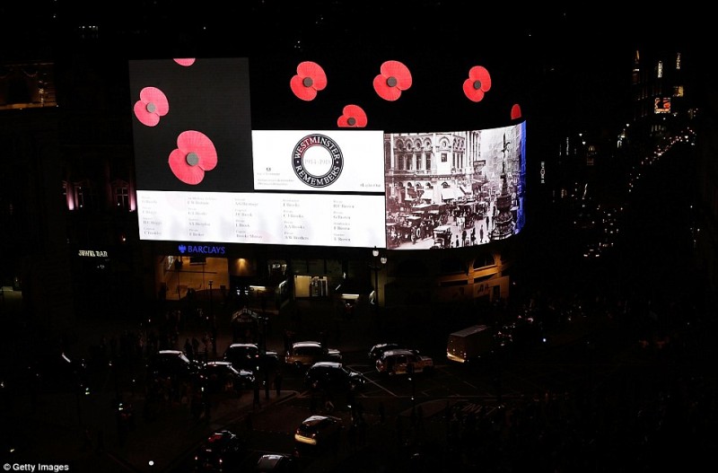 A single beam pierces the sky as the lights go out across Britain: Tributes to the fallen a century since World War One was declared  9