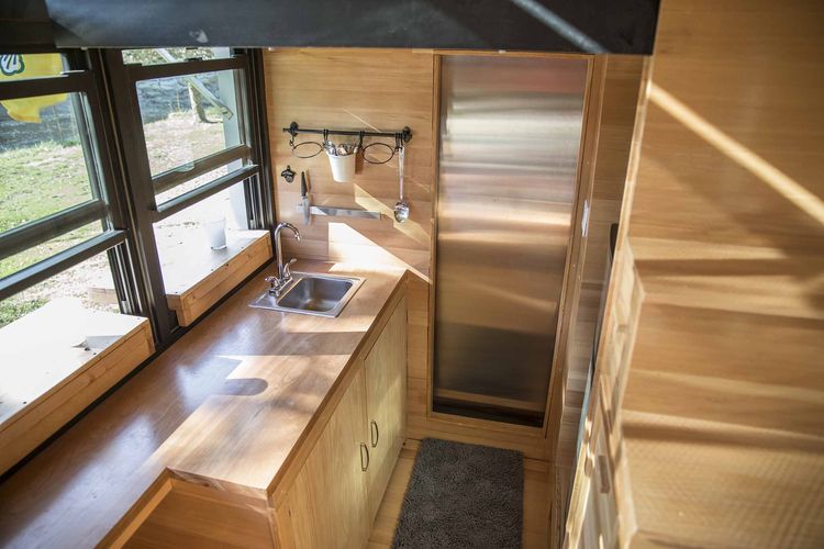 Modest 192-Square-Foot Eco Tiny Home Hides Open Deck And Glass Wall 2