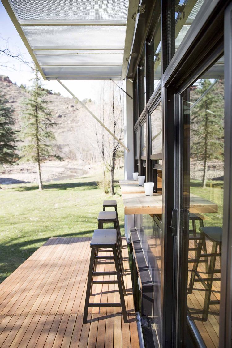 Modest 192-Square-Foot Eco Tiny Home Hides Open Deck And Glass Wall 3
