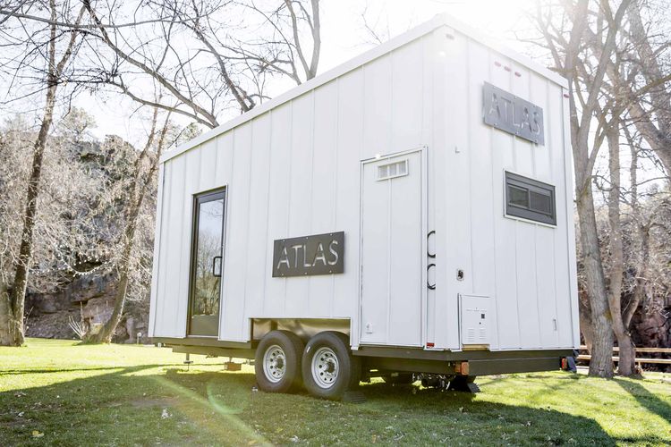 Modest 192-Square-Foot Eco Tiny Home Hides Open Deck And Glass Wall 4