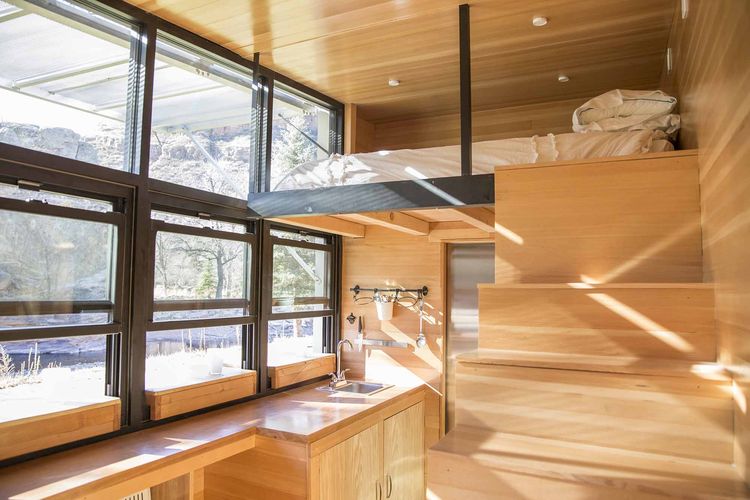 Modest 192-Square-Foot Eco Tiny Home Hides Open Deck And Glass Wall 8