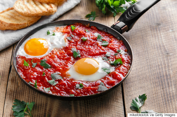 fried eggs in tomato sauce in the pan