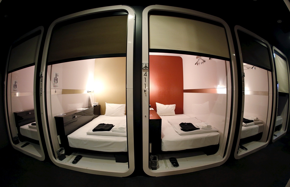 "Business-class" cabins are seen at First Cabin hotel, which was converted from an old office building, in Tokyo, July 3, 2015. Record tourists to Japan are stretching the ability of hotels to accommodate them in a sector constrained by high costs, forcing developers to think out of the box for means to quickly increase lodging options without breaking the bank. Picture taken July 3, 2015. REUTERS/Toru Hanai